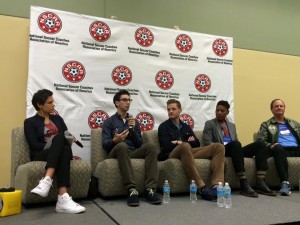 Atticus (second from left) and Robbie Roberts (third from left) discussing inclusion in sports.