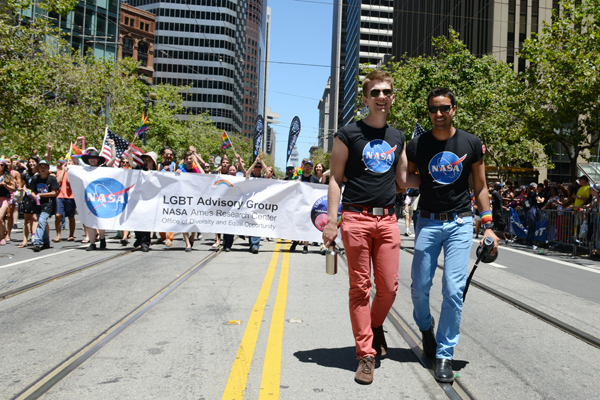 Wells Fargo Point Scholar (right) marches with his fiancé Andrew (photo by: Megan Prakash)